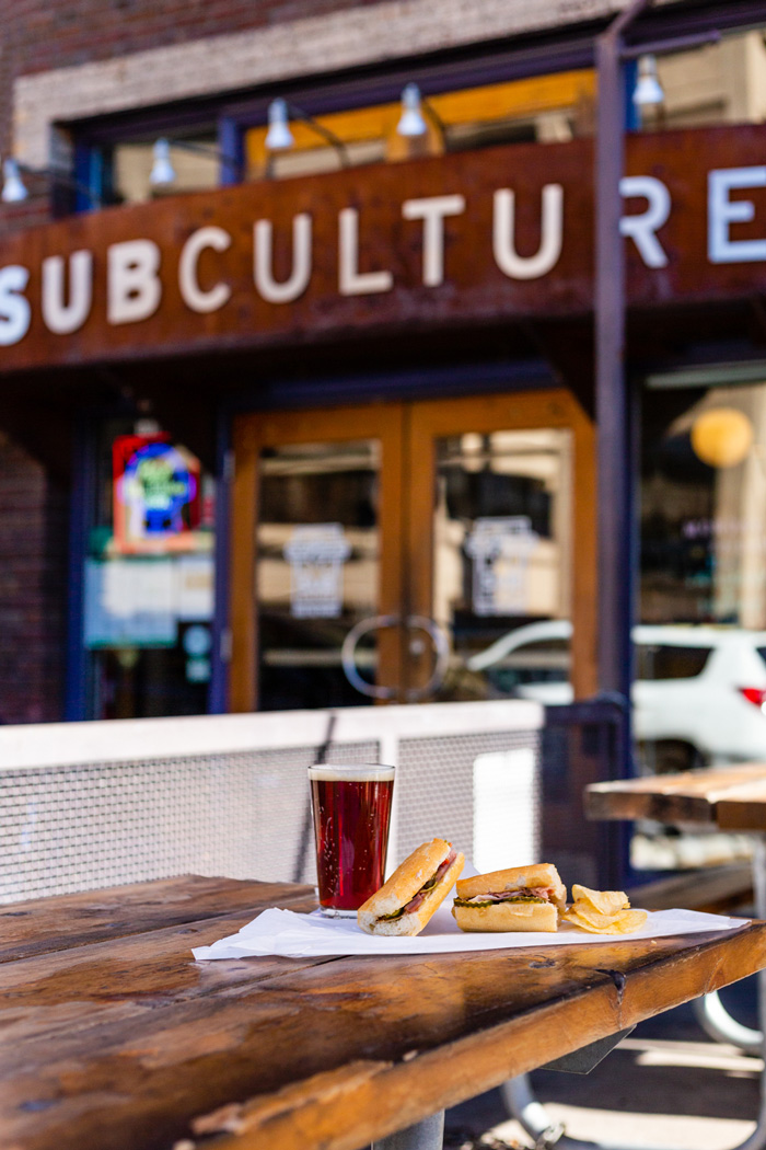 Patio outside SubCulture, best subs in Denver, with a beer